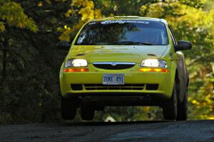 Jim Stevens / Marianne Stevens catch a little air at the midpoint jump on Brockway Mtn. 2, SS16, in their Suzuki Swift.