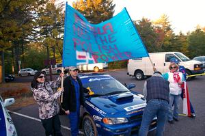 Polish fans surround the Piotr Fetela / Dariusz Belzowski Subaru Impreza after the finish. (2)