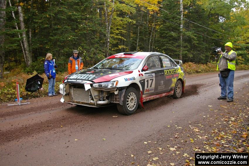 Antoine L'Estage / Nathalie Richard blast away from the start of Delaware 1, SS11, in their Mitsubishi Lancer Evo X.