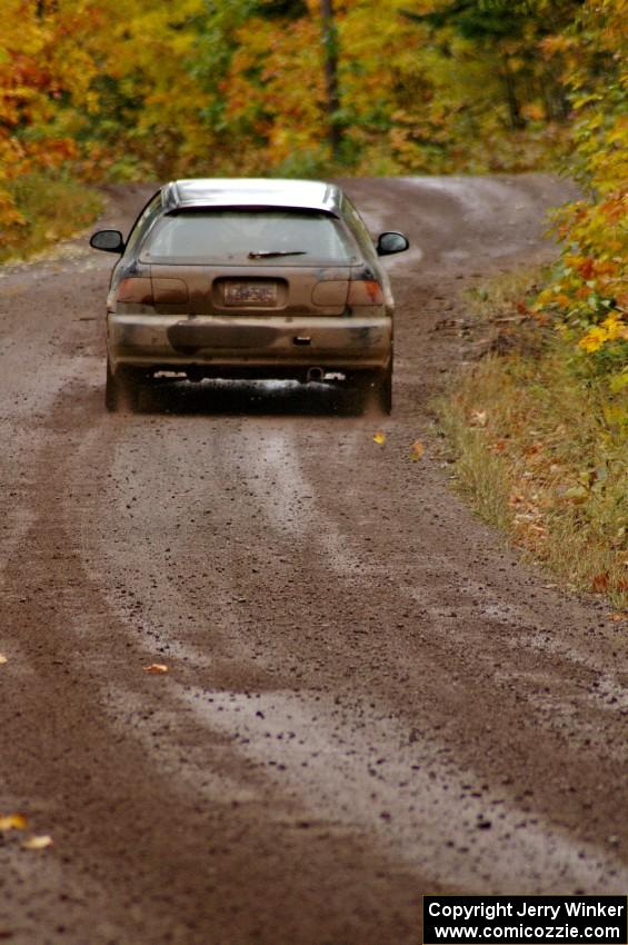 Silas Himes / Matt Himes rocket uphill from the start of Delaware 1, SS11, in their Honda Civic.