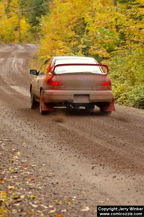 Dustin Kasten / Corina Soto shift their Subaru Impreza into second on the uphill start of Delaware 1, SS11.