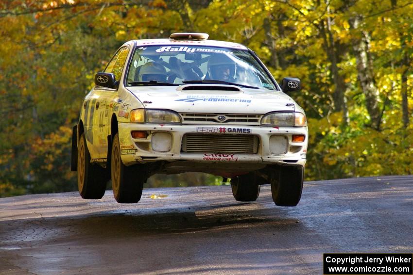 Henry Krolikowski / Cindy Krolikowski catch nice air in their Subaru Impreza on the midpoint jump on Brockway Mtn. 1, SS13.