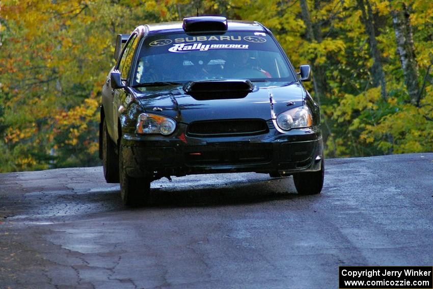 Vio Dobasu / Rob Amato catch a little air at the midpoint jump on Brockway Mtn. 1, SS13, in their Subaru WRX STi.