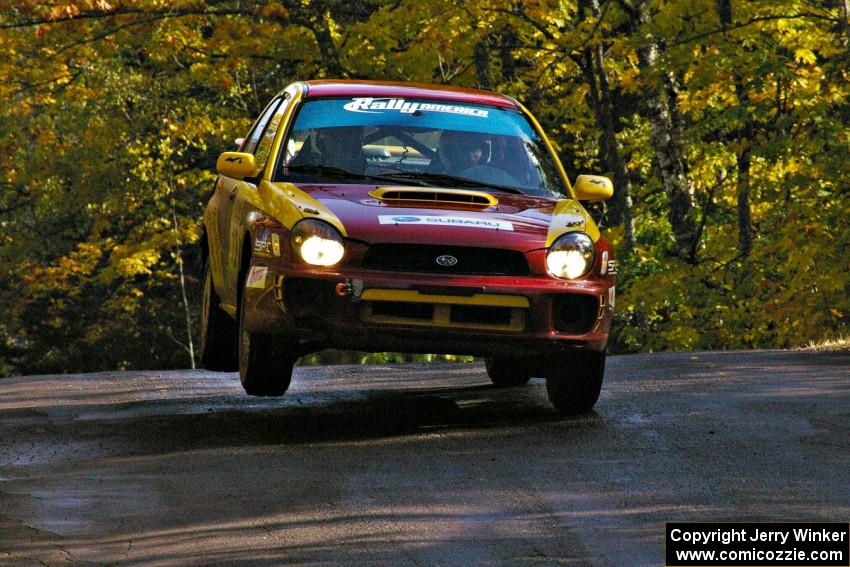 Bryan Pepp / Jerry Stang catch air at the midpoint jump on Brockway Mtn. 1, SS13, in their Subaru WRX.