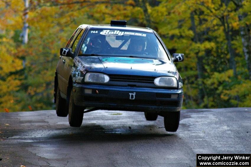 Paul Koll / Tim Knorr catch air at the midpoint jump on Brockway Mtn. 1, SS13, in their VW Golf.