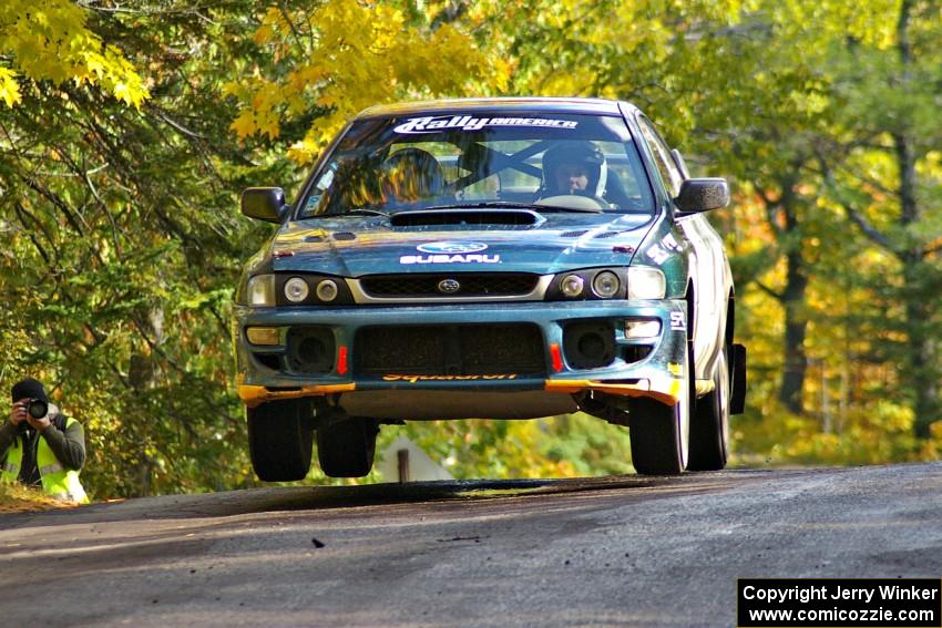 Jaroslaw Sozanski / Bartosz Sawicki catch air at the midpoint jump of Brockway Mtn. 1, SS13, in their Subaru Impreza RS.