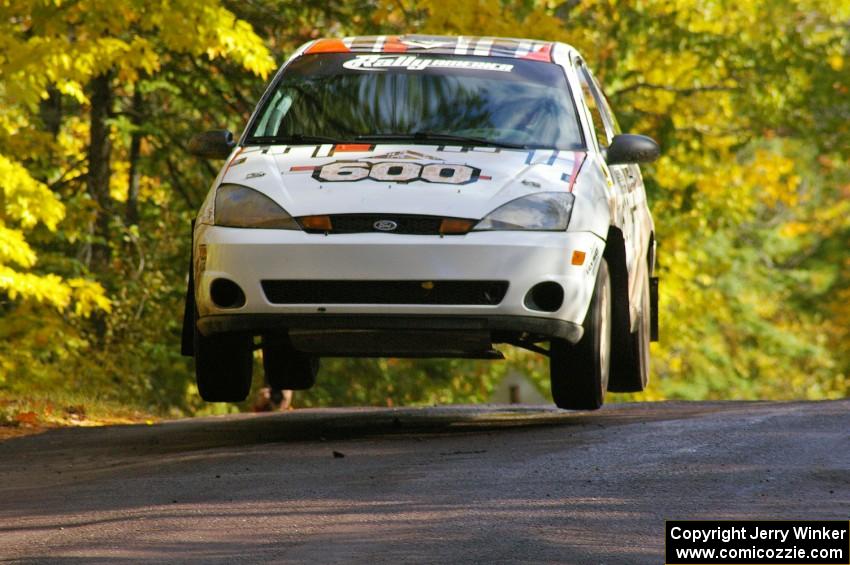 Dillon Van Way / Ben Slocum catch nice air at the midpoint jump on Brockway Mtn. 1, SS13, in their Ford Focus.