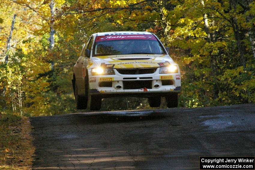 Andi Mancin / Maciej Wislawski catch air at the midpoint jump on Brockway Mtn. 2, SS16, in their Mitsubishi Lancer Evo 9.