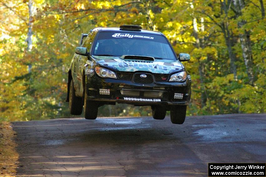 Mark Fox / Jake Blattner catch nice air at the midpoint jump on Brockway Mtn. 2, SS16, in their Subaru WRX STi.