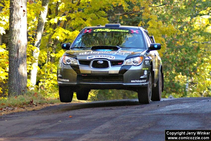 Jimmy Keeney / Missy Keeney catch a little air at the midpoint jump on Brockway Mtn. 2, SS16, in their Subaru WRX STi.