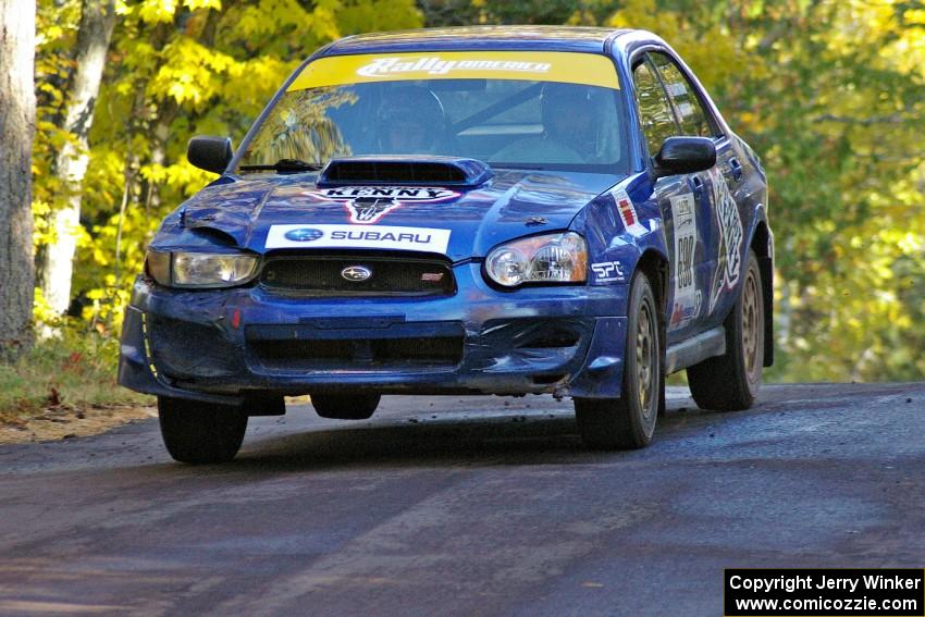 Kenny Bartram / Dennis Hotson take it easy at the midpoint jump on Brockway 2, SS16, in their Subaru WRX STi.