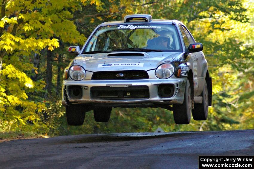 Evan Cline / Jason Grahn catch nice air at the midpoint jump on Brockway Mtn. 2, SS16, in their Subaru Impreza.