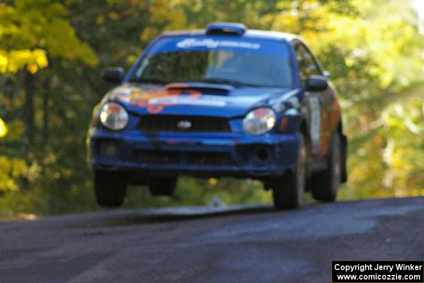 Tim Penasack / Alex Kihurani catch air at the midpoint jump on Brockway Mtn. 2, SS16, in their Subaru WRX.