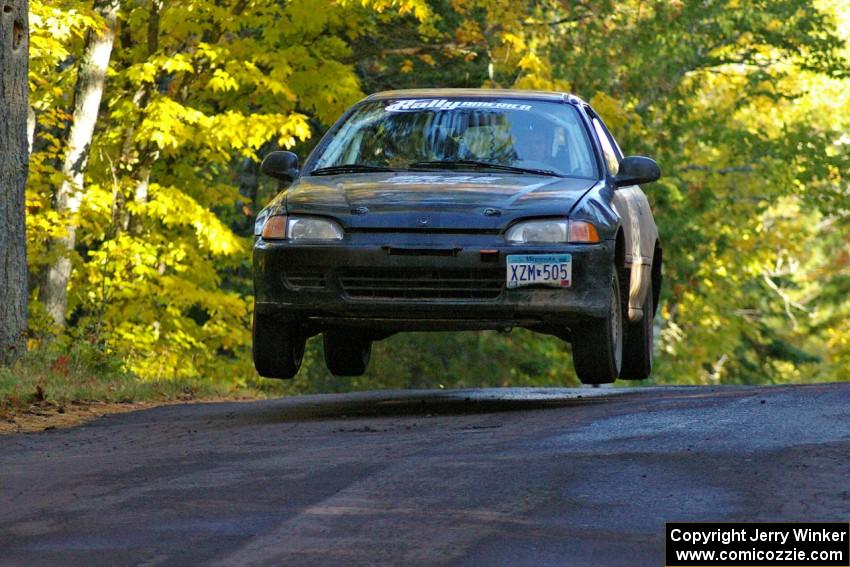 Silas Himes / Matt Himes catch air at the midpoint jump on Brockway Mtn. 2, SS16, in their Honda Civic.
