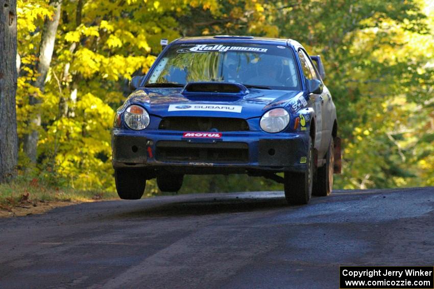 The Janusz Topor / Michal Kaminski Subaru WRX STi catches air at the midpoint jump on Brockway Mtn. 2, SS16.