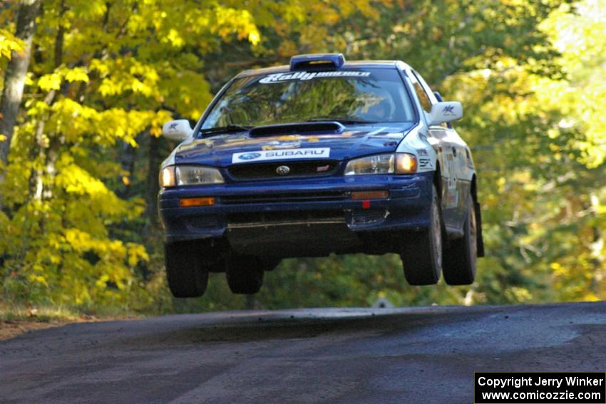 Mason Moyle / Scott Putnam catch air at the midpoint jump on Brockway Mtn. 2, SS16, in their Subaru Impreza.