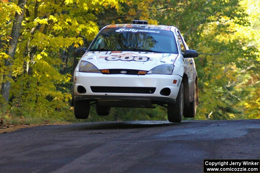 Dillon Van Way / Ben Slocum catch nice air at the midpoint jump on Brockway Mtn. 2, SS16, in their Ford Focus.