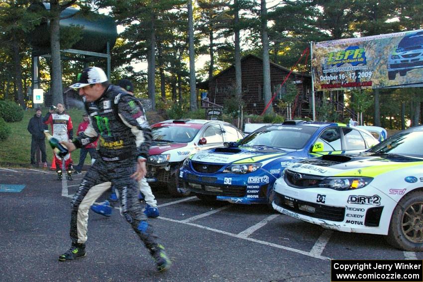 Ken Block gets doused with champagne at the ceremonial finish.