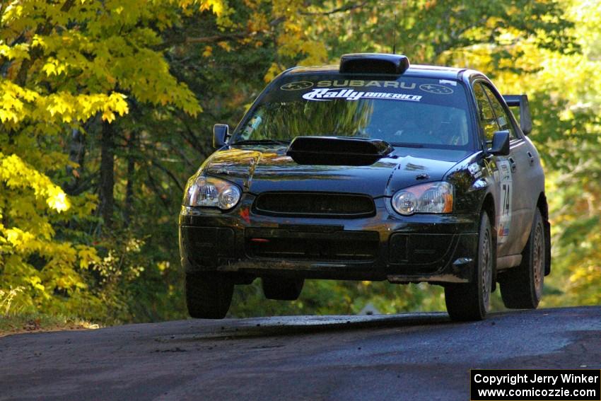 Vio Dobasu / Rob Amato catch some air at the midpoint jump on Brockway Mtn. 2, SS16, in their Subaru WRX STi.