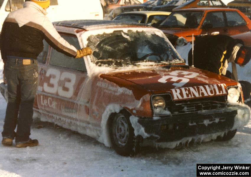 John Dozier's Renault LeCar was heavily coated in thick ice.