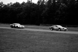 The Chevy Camaro of Joe Llauget leads Gene Felton's Chevy Camaro.