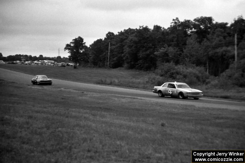 Butch Goff's Chevy Malibu ahead of Lyn St. James's Mercury Capri into 7/8.