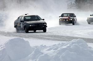 The Ty Saiki / Pete Forrey VW Passat is chased by the Lyle Nienow / Mark Nienow Chevy Cavalier Z-24.