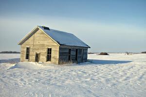 Old house on the prairie in winter.