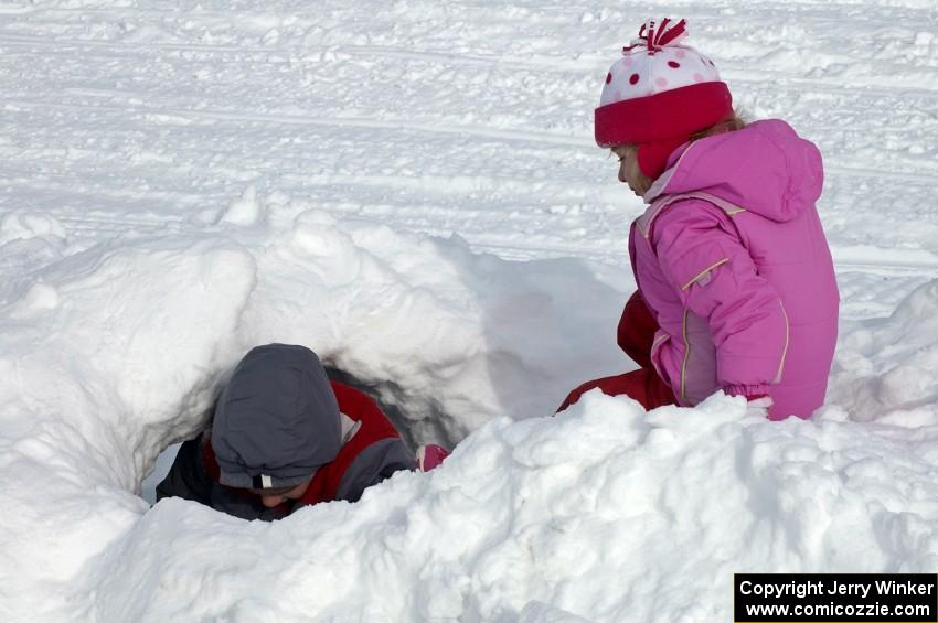 Making a tunnel in the snowbank on the lake access road.