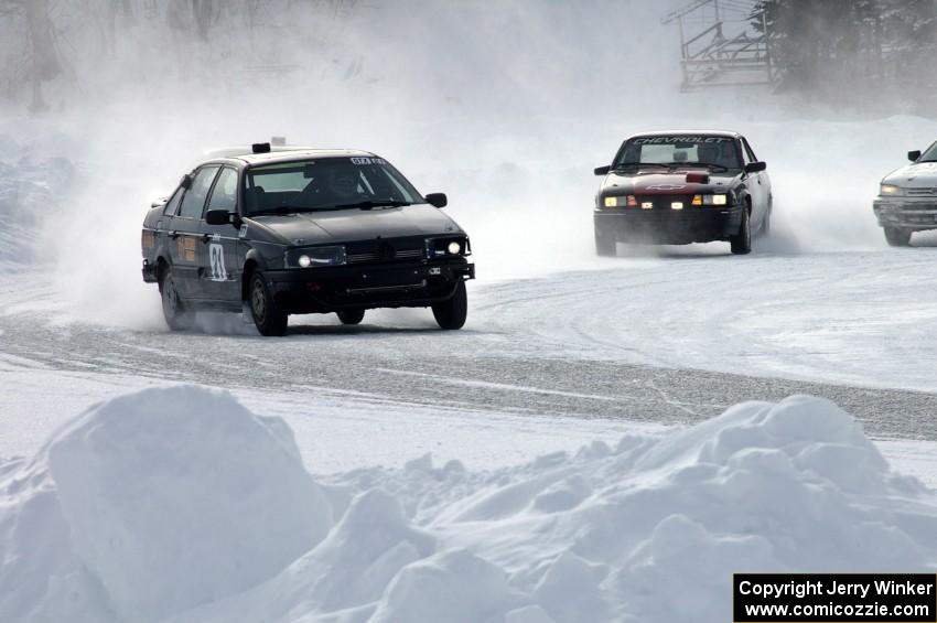 The Ty Saiki / Pete Forrey VW Passat is chased by the Lyle Nienow / Mark Nienow Chevy Cavalier Z-24.