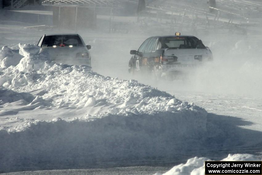 The Ty Saiki / Pete Forrey VW Passat chases the Kevin Beck / Brent Carlson Subaru Impreza.