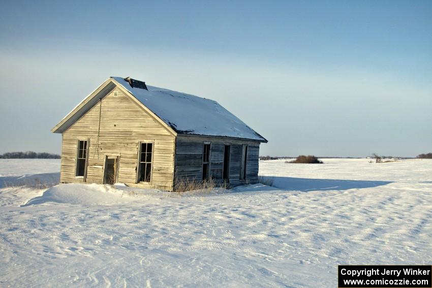 Old house on the prairie in winter.