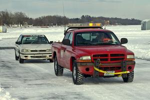 The Carl Siegler / David Goodman / Dan Drury Subaru Legacy is towed into the pits.