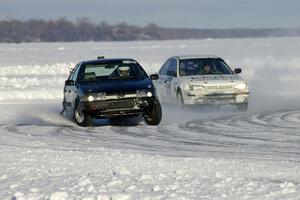 The Ty Saiki / Mike Ehleringer VW Passat is chased by the Kevin Beck / Brent Carlson Subaru Impreza.