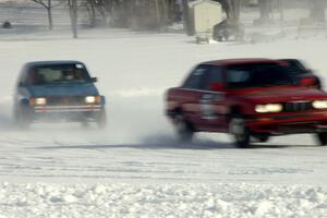 Pete Tavenier / Bruce Powell BMW 318i and Paul Palzer / Cindy Palzer / Dave Kapaun VW Rabbit GTI