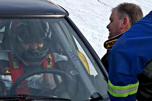 Don Hupe talks to Marco Martinez in their Mazda RX-7.