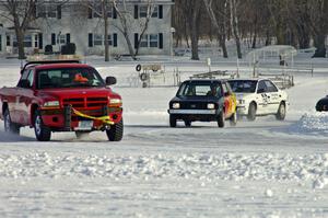 The field comes through the final tight corner just before the start of a Saturday sprint race.