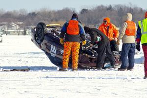 Corner crew members assess the Bonnie Stoehr / Jake Weber / Pete Weber Mitsubishi Eclipse.