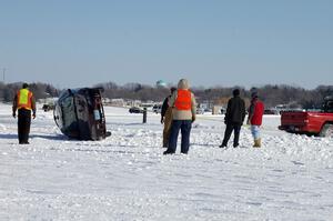 The Bonnie Stoehr / Jake Weber / Pete Weber Mitsubishi Eclipse is flipped back over.