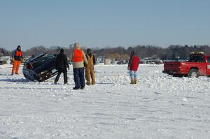 The Bonnie Stoehr / Jake Weber / Pete Weber Mitsubishi Eclipse is flipped back over.