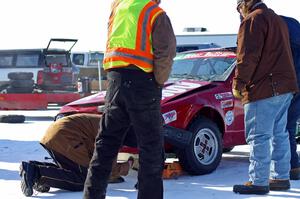 The crew assesses the Mark Knepper / Josh Peterson Alfa-Romeo GTV-6.