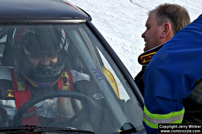 Don Hupe talks to Marco Martinez in their Mazda RX-7.