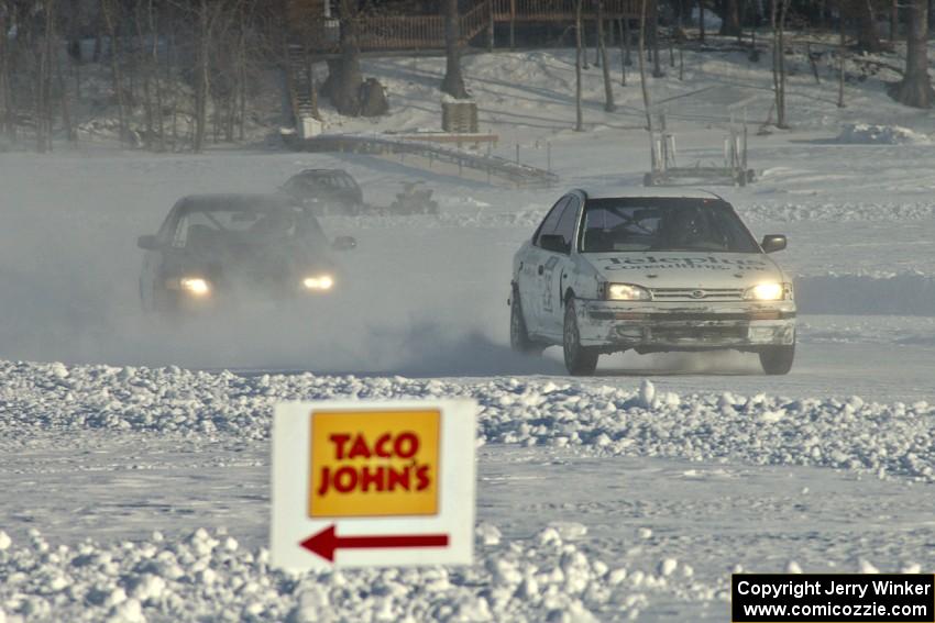 The Kevin Beck / Brent Carlson Subaru Impreza chased by the Ty Saiki / Pete Forrey VW Passat.