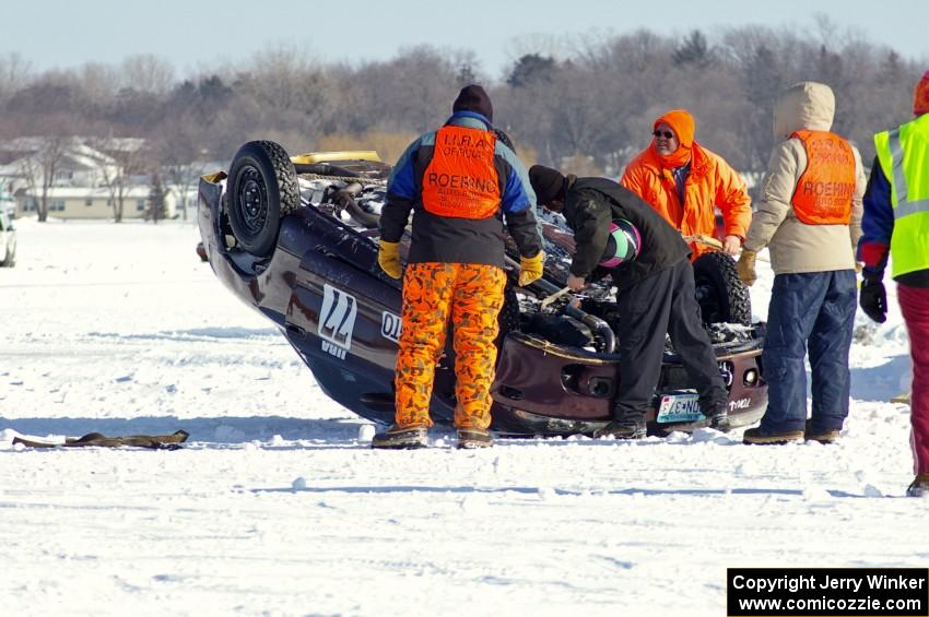 Corner crew members assess the Bonnie Stoehr / Jake Weber / Pete Weber Mitsubishi Eclipse.