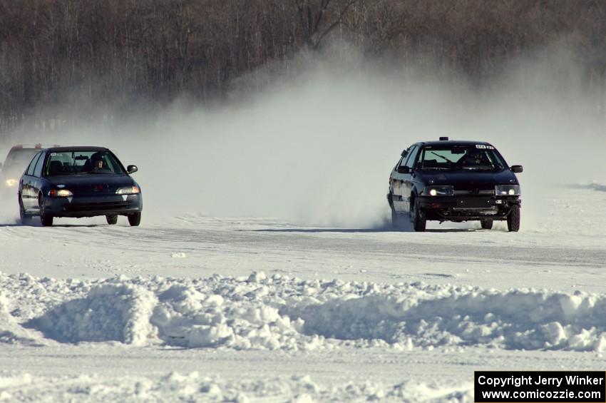 The Ryan Hammond / Kyle Laursen Honda Civic and Ty Saiki / Pete Forrey VW Passat on the front straight.