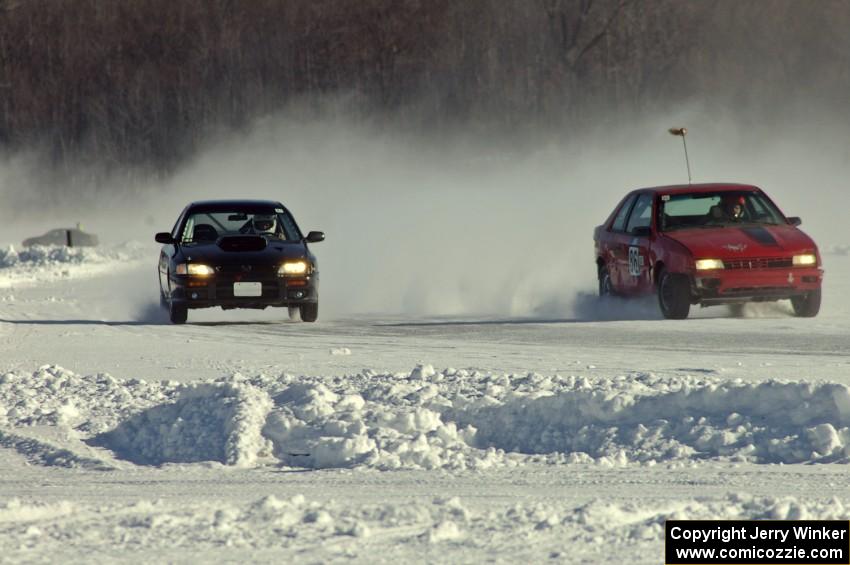 The Chad Reinhofer / Jason Lindell Dodge Shadow and Tim Stone / Dan Gervais Subaru Impreza on the front straight.