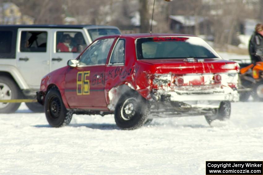 The Chad Reinhofer / Jason Lindell Dodge Shadow is towed off the track.