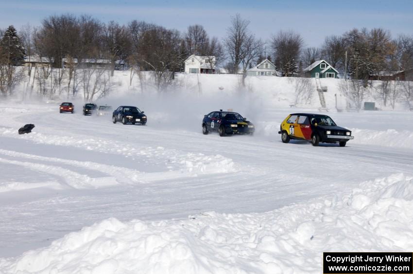 The field streams through on the first lap.