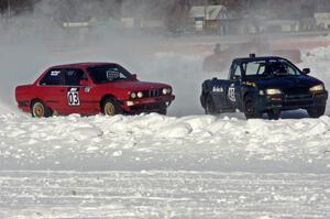 Pete Tavenier / Bruce Powell BMW 318i and Leo Nesseth's Subaru Impreza Wagon in turn one.