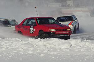 The Chad Reinhofer / Jason Lindell / Cody Reinhofer Plymouth Sundance, and Andy Orr / Jerry Orr Mazda 323GTX in turn one.